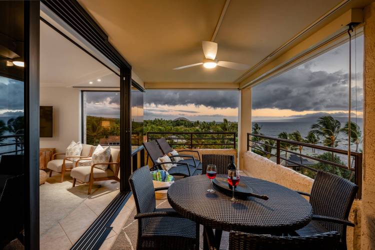 A condo porch in hawaii with wine on the table